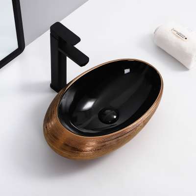 Factory direct supply oval shape countertop sink glossy black +glossy rose gold  ceramic glaze+electroplate basin